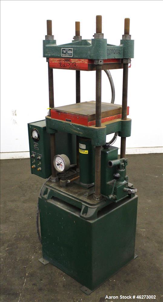 Used Carver Laboratory Manual Press, Model 2699, 30 Ton Clamping Force. Hydraulic, 4 post upstroke type. (2) 12" long x 12" wide electrically heated platens. Maximum temperature 650 degrees F. 6" Str...