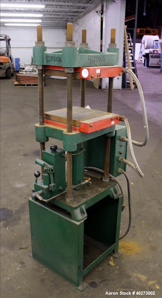 Used Carver Laboratory Manual Press, Model 2699, 30 Ton Clamping Force. Hydraulic, 4 post upstroke type. (2) 12" long x 12" wide electrically heated platens. Maximum temperature 650 degrees F. 6" Str...