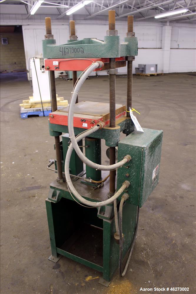 Used Carver Laboratory Manual Press, Model 2699, 30 Ton Clamping Force. Hydraulic, 4 post upstroke type. (2) 12" long x 12" wide electrically heated platens. Maximum temperature 650 degrees F. 6" Str...