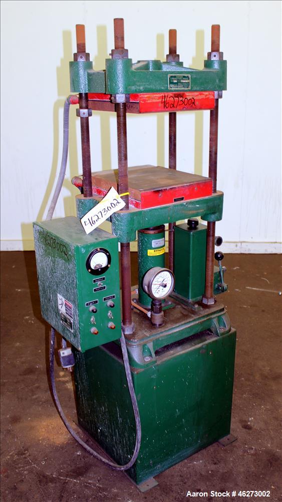 Used Carver Laboratory Manual Press, Model 2699, 30 Ton Clamping Force. Hydraulic, 4 post upstroke type. (2) 12" long x 12" wide electrically heated platens. Maximum temperature 650 degrees F. 6" Str...
