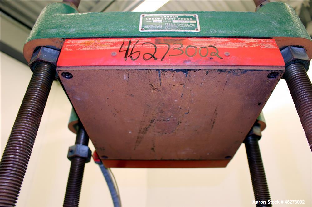 Used Carver Laboratory Manual Press, Model 2699, 30 Ton Clamping Force. Hydraulic, 4 post upstroke type. (2) 12" long x 12" wide electrically heated platens. Maximum temperature 650 degrees F. 6" Str...