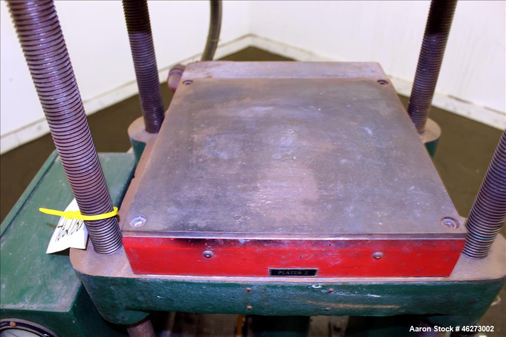 Used Carver Laboratory Manual Press, Model 2699, 30 Ton Clamping Force. Hydraulic, 4 post upstroke type. (2) 12" long x 12" wide electrically heated platens. Maximum temperature 650 degrees F. 6" Str...
