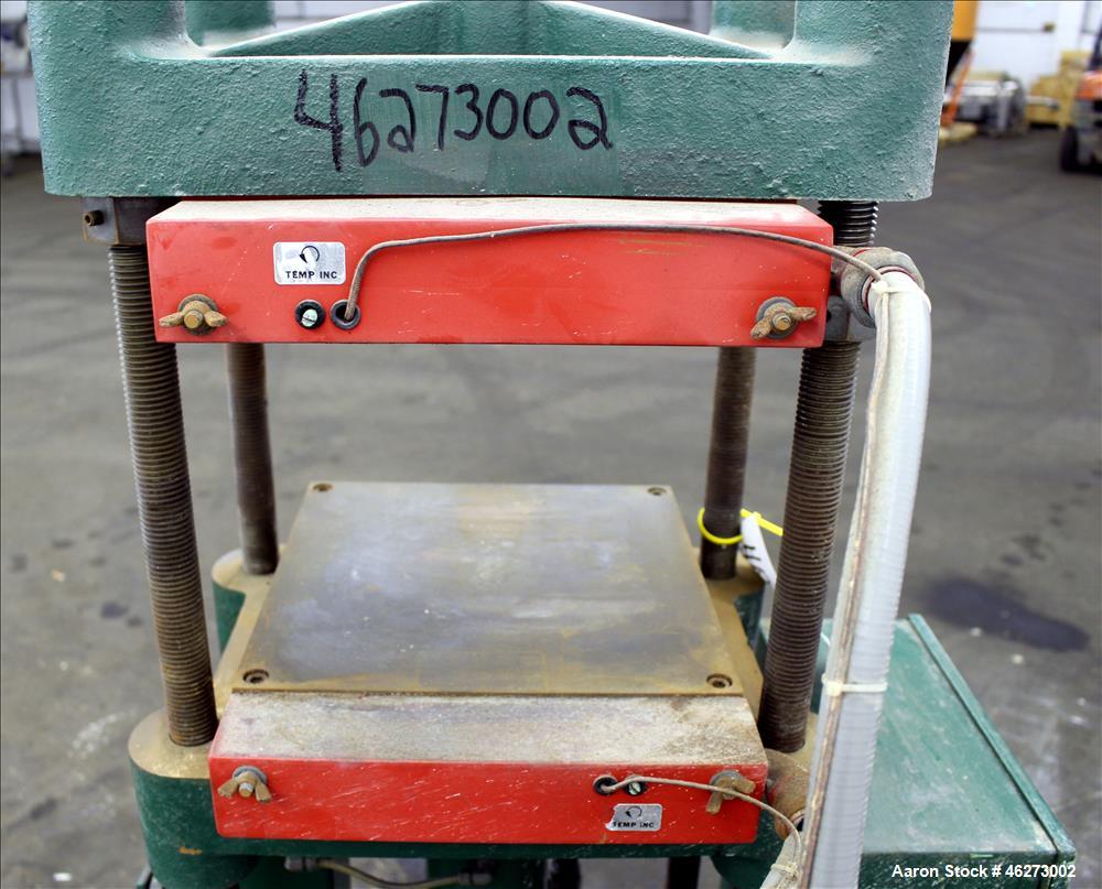 Used Carver Laboratory Manual Press, Model 2699, 30 Ton Clamping Force. Hydraulic, 4 post upstroke type. (2) 12" long x 12" wide electrically heated platens. Maximum temperature 650 degrees F. 6" Str...