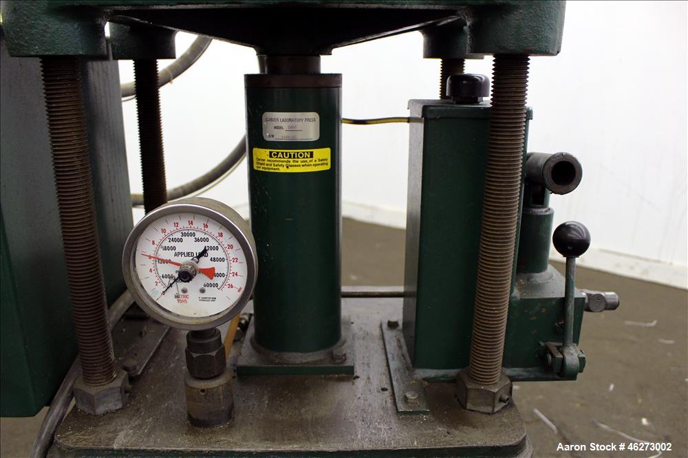 Used Carver Laboratory Manual Press, Model 2699, 30 Ton Clamping Force. Hydraulic, 4 post upstroke type. (2) 12" long x 12" wide electrically heated platens. Maximum temperature 650 degrees F. 6" Str...