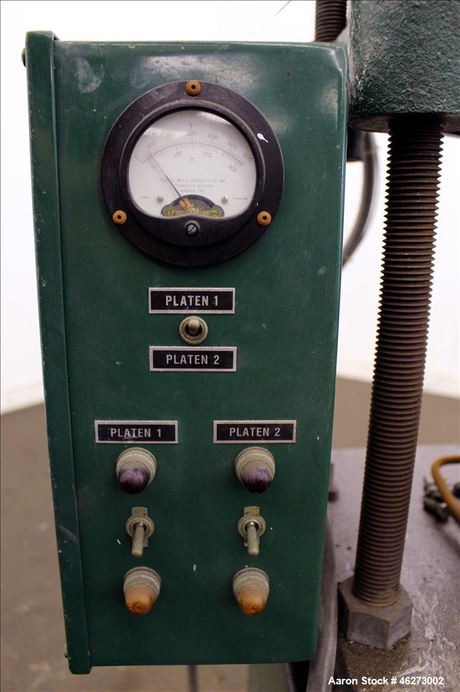 Used Carver Laboratory Manual Press, Model 2699, 30 Ton Clamping Force. Hydraulic, 4 post upstroke type. (2) 12" long x 12" wide electrically heated platens. Maximum temperature 650 degrees F. 6" Str...