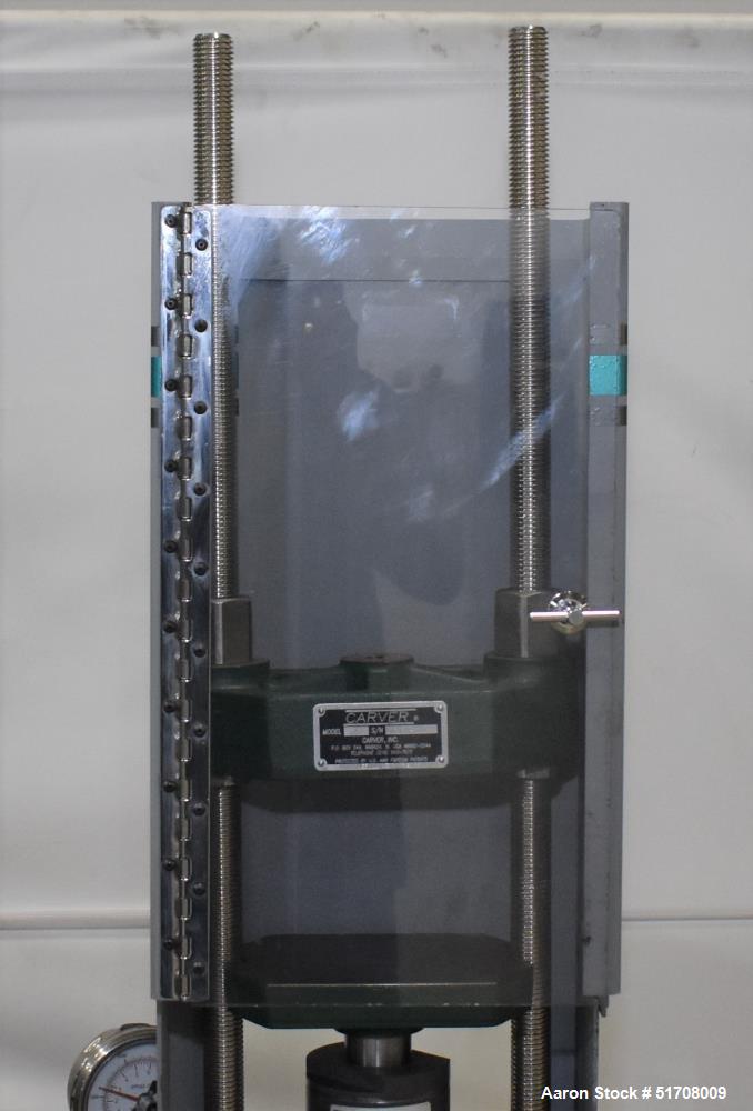 Used Carver Standard Press, Model 3851 (C). 12 Ton clamping force. Non-heated platen size 6" x 6". Ram stroke 5.1". Daylight opening .75 to 18". (2) Tie bars, approximate 1-1/8" diameter. Manual hydr...