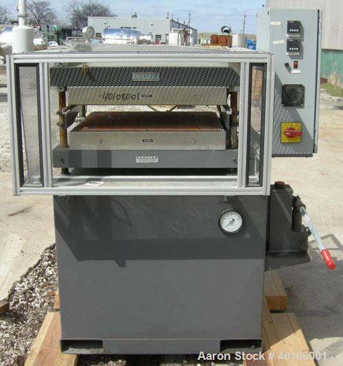Used:  Carver 4 Post Manual Hydraulic Press, Model 4902. 30 ton clamp force capacity.  (2) 24" x 24" electrically heated, water cooled platens, rated to 650 degrees F.  6" ram stroke, 1-4" daylight o...
