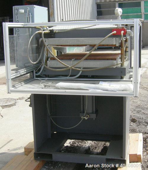 Used:  Carver 4 Post Manual Hydraulic Press, Model 4902. 30 ton clamp force capacity.  (2) 24" x 24" electrically heated, water cooled platens, rated to 650 degrees F.  6" ram stroke, 1-4" daylight o...