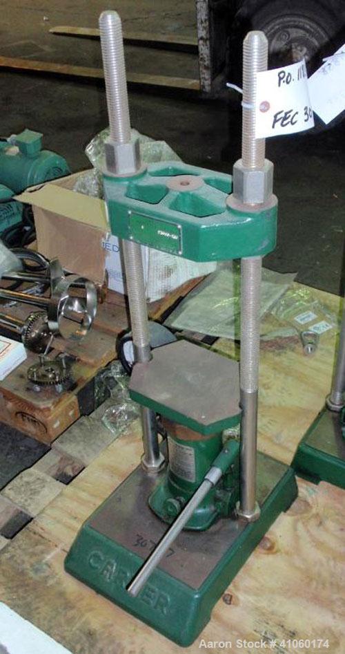 Used Carver Manual Hydraulic Lab Press, 12 Ton Clamping Force, Model C. Requires (2) 6" x 6" platens. Ram stroke 5.1", daylight opening 3/4" to 18".