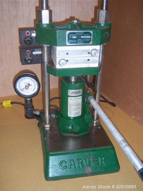 Used Carver Hydraulic Laboratory Press, Model C.  12 ton, manual, bench top, heated 6" platens. Each platen is flat, aluminum, has an installed dial type temperature gauge and has manual temperature ...