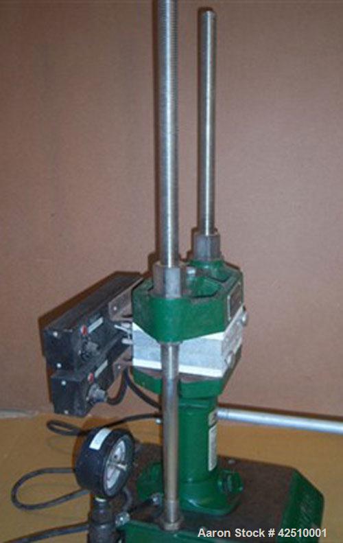 Used Carver Hydraulic Laboratory Press, Model C.  12 ton, manual, bench top, heated 6" platens. Each platen is flat, aluminum, has an installed dial type temperature gauge and has manual temperature ...