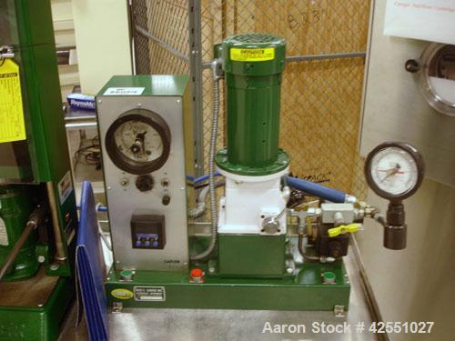 Used Carver Press, Model C, 15 ton compression pressure, with hydraulic pump with 1/2 hp 90 volt motor, pump serial #2822-324, press serial #31000-998.