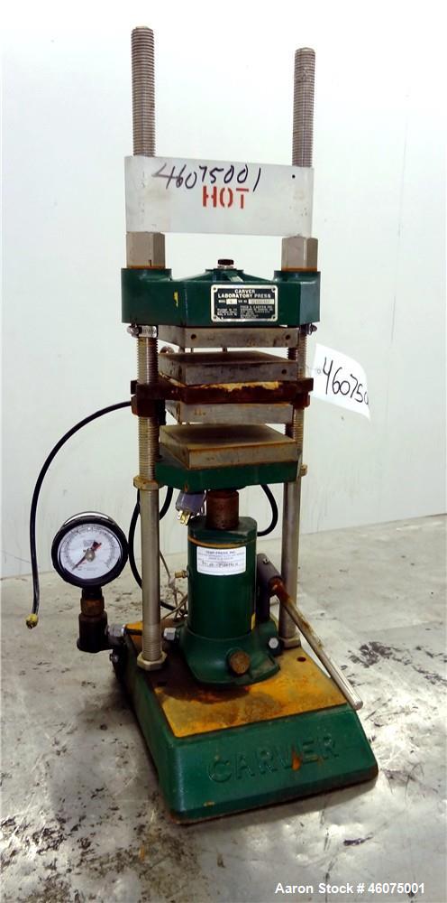 Used Carver Manual (2) Column Hydraulic Laboratory Press, 12 Ton Clamping Force, Model C. (2) 6" Wide x 6" long electrically heated platens, (2) 6" wide x 6" long water cooled platens. Maximum temper...