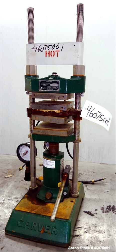 Used Carver Manual (2) Column Hydraulic Laboratory Press, 12 Ton Clamping Force, Model C. (2) 6" Wide x 6" long electrically heated platens, (2) 6" wide x 6" long water cooled platens. Maximum temper...