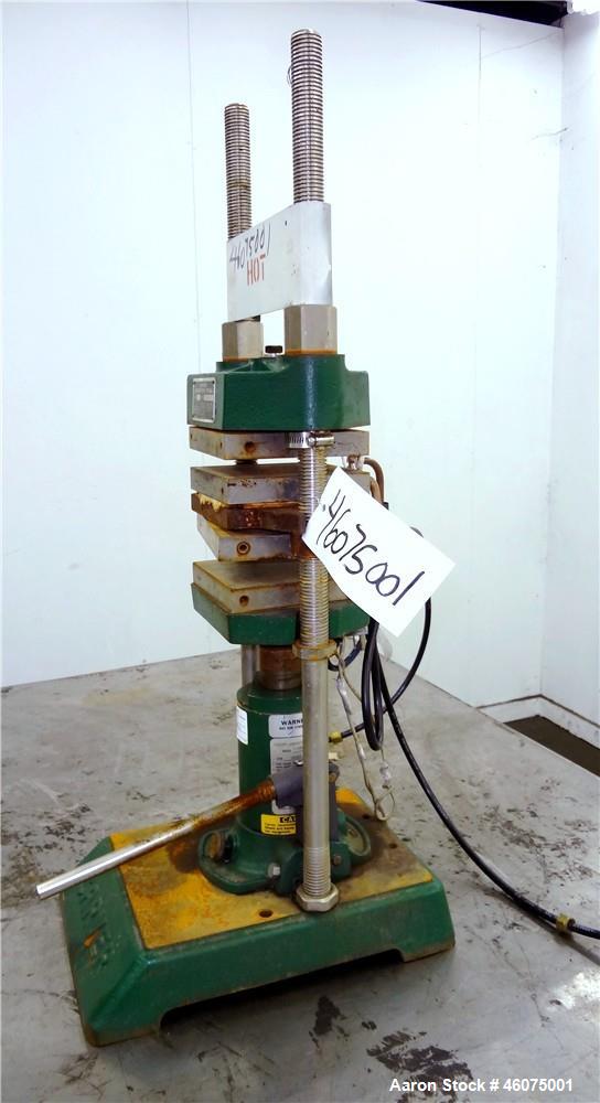 Used Carver Manual (2) Column Hydraulic Laboratory Press, 12 Ton Clamping Force, Model C. (2) 6" Wide x 6" long electrically heated platens, (2) 6" wide x 6" long water cooled platens. Maximum temper...