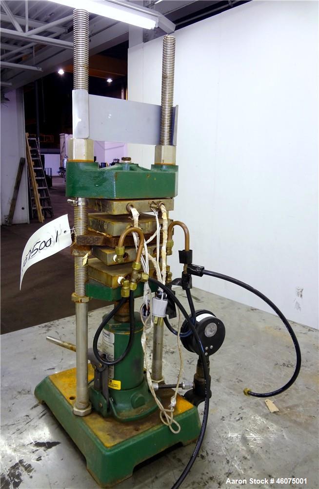 Used Carver Manual (2) Column Hydraulic Laboratory Press, 12 Ton Clamping Force, Model C. (2) 6" Wide x 6" long electrically heated platens, (2) 6" wide x 6" long water cooled platens. Maximum temper...