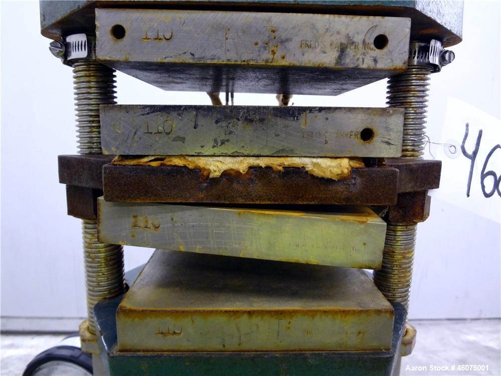 Used Carver Manual (2) Column Hydraulic Laboratory Press, 12 Ton Clamping Force, Model C. (2) 6" Wide x 6" long electrically heated platens, (2) 6" wide x 6" long water cooled platens. Maximum temper...