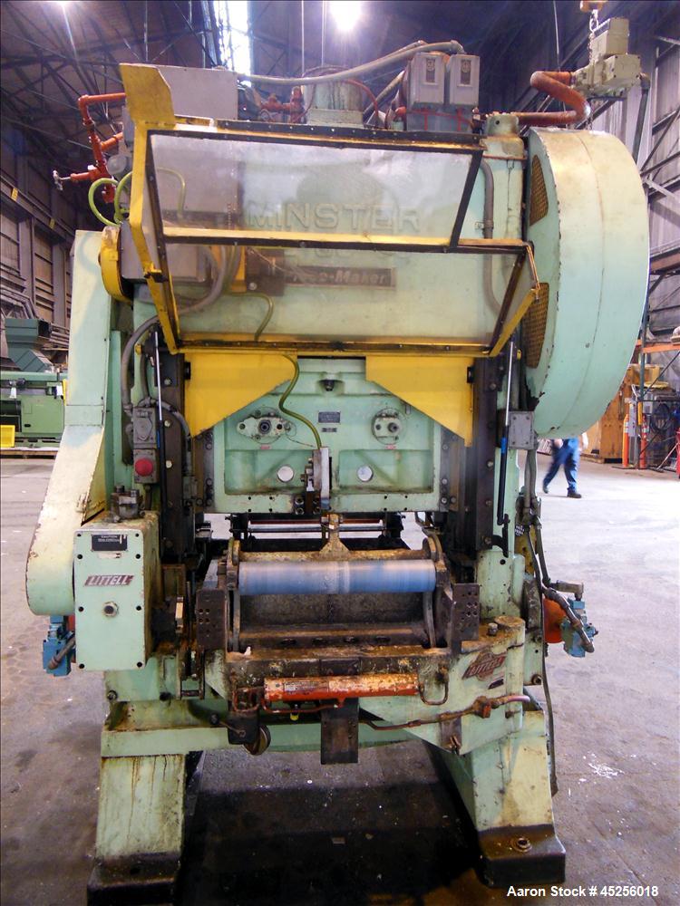 Used  Minster 60 Ton Straight Side Press, Model # P2-60. 60 ton capacity, Press bed area 36" X 25", Stroke of slide - 2", Adjustment of slide - 3", Shut height - 14", Scrap chute opening 16" X 7", St...