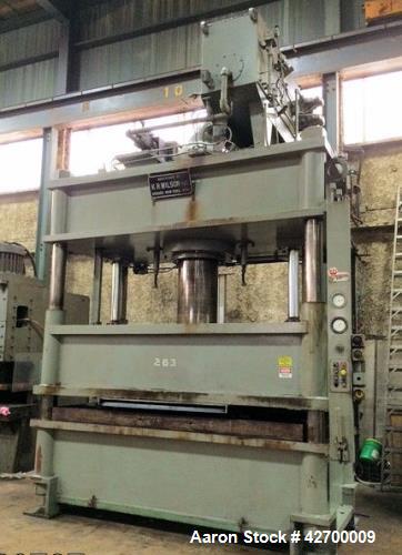 Used 600 Ton KR Wilson Hydraulic Press. 4 post downstroke type. Floor standing. Distance between 7" diameter posts 120" L-R x 47.5" F-B. Area of bed (nominal) 120" L-R x 66" F-B. Overall dimension of...