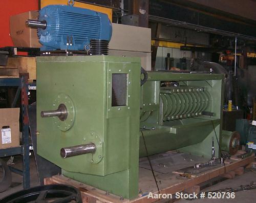 USED: Alloy mechanical screw press, carbon steel. 12' OAL x 45" wide, 9" feed quill, 7" barrel, belt driven by a 75 hp motor. Used for beef, pork, poultry and lamb products as well as vegetable oil e...