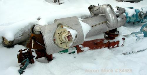 Used Pondorf Screw Press, 304 Stainless Steel. Approximate 12" diameter x 48" long screw. Driven by a 7.5 HP, 3/60/460 Volt, 1680 RPM varispeed gearmotor. Includes a carbon steel feed tank with a con...