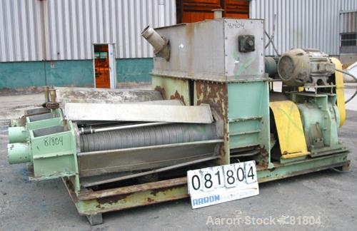 USED: Vetter Triple Screw Press, 316 stainless steel. (3) approximately 14" diameter x 6' long tapered screws, each driven by a 20 hp, 3/60/230/460 volt, 1750 rpm motor thru reducers, ratio 87:1. Top...