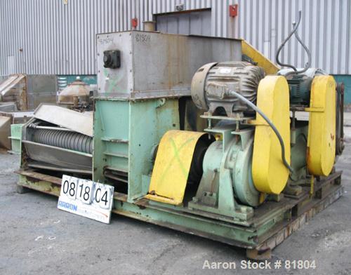 USED: Vetter Triple Screw Press, 316 stainless steel. (3) approximately 14" diameter x 6' long tapered screws, each driven by a 20 hp, 3/60/230/460 volt, 1750 rpm motor thru reducers, ratio 87:1. Top...