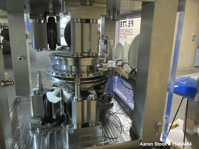 Used Used Fette 2090i WiP rotary tablet press, 36 station, 100 Kn pre-compression, 100 Kn main compression, single sided, keyed upper punch guides, 16 mm max tablet diameter, 18 mm max depth of fill,...
