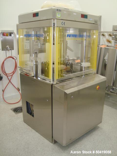 Used Fette 1200i Rotary Pharmaceutical Tablet Press With (24-Station B-Turret) With Hydraulic Lift Transport Cart, Fette Compacting Workstation Controller Panel, Mobile Stainless Steel Parts Clean Ra...