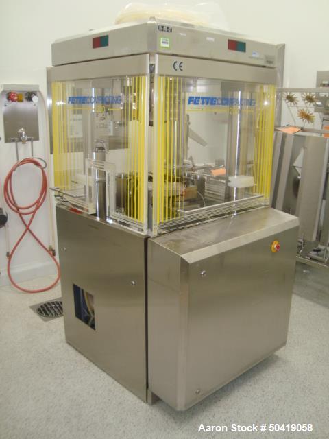 Used-Fette 1200i Rotary Pharmaceutical Tablet Press With (24-Station B-Turret) With Hydraulic Lift Transport Cart, Fette Com...