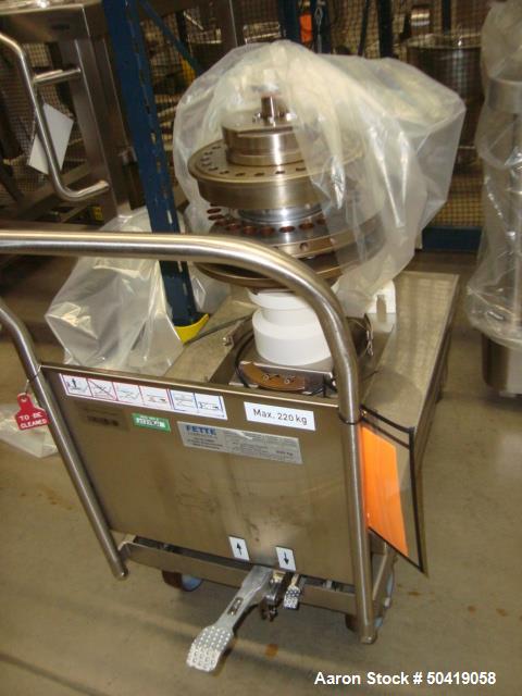 Used Fette 1200i Rotary Pharmaceutical Tablet Press With (24-Station B-Turret) With Hydraulic Lift Transport Cart, Fette Compacting Workstation Controller Panel, Mobile Stainless Steel Parts Clean Ra...
