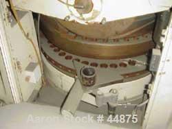 USED: Manesty high speed rotary tablet press, rota press mk11a, 45 stations, double sided keyed head, tablets per min 1640-8200, variable speed, maximum diameter 5/8 (15.8 mm), maximum depth of fill ...