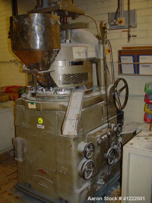 Used Manesty Rotary Tablet Press, Model RS3. 14 station, 20 ton total compression pressure. Includes tooling, punch holders, punches, dies and spare cam. Reported to be reconditioned.