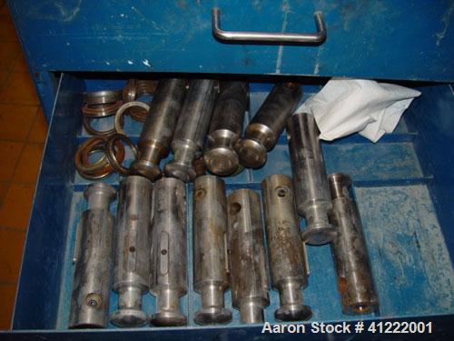 Used Manesty Rotary Tablet Press, Model RS3. 14 station, 20 ton total compression pressure. Includes tooling, punch holders, punches, dies and spare cam. Reported to be reconditioned.