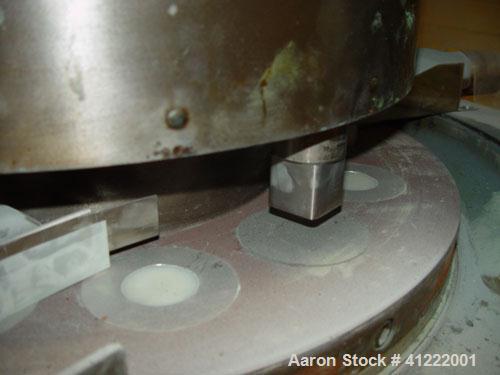 Used Manesty Rotary Tablet Press, Model RS3. 14 station, 20 ton total compression pressure. Includes tooling, punch holders, punches, dies and spare cam. Reported to be reconditioned.