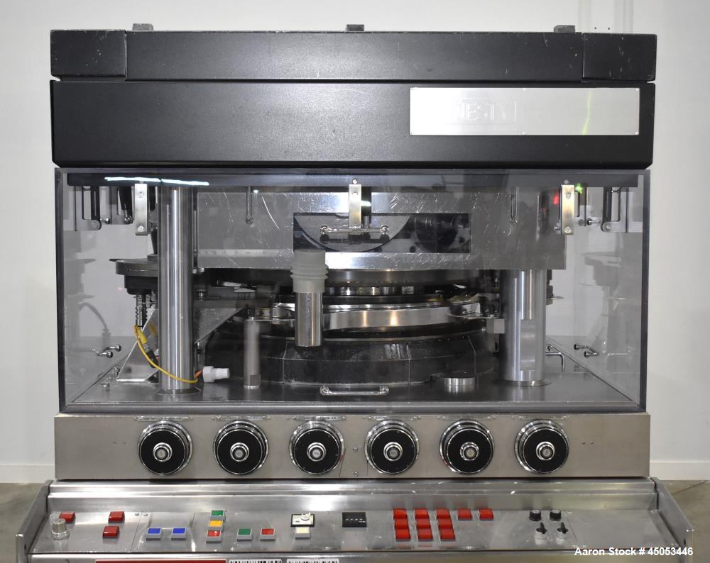 Used Manesty Mark IV 75 Station Rotary Tablet Press. Max press output 600,300 per hour (single layer), 300,150 per hour (bi-layer). Max depth of fill 17.46mm, max tablet diameter 11mm. Pre-compressio...