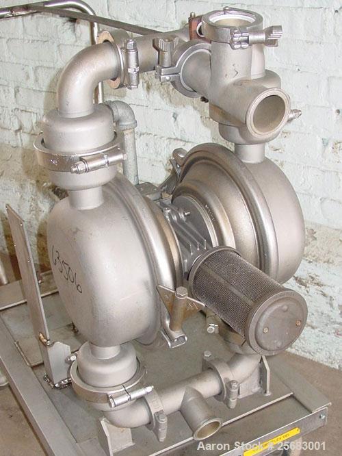 Used Diaphragm Pump, Air Operataed, stainless steel. 2" tri-clamp inlet/outlet. Mounted on a stainless steel cart with casters.
