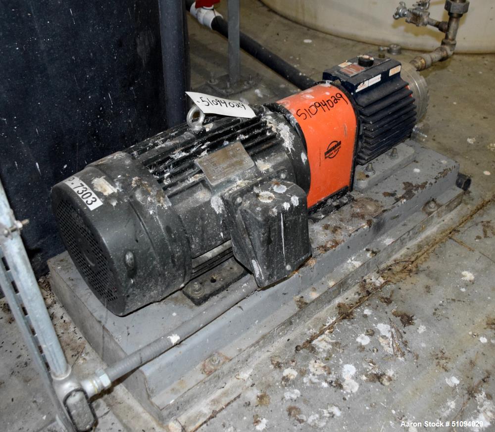 Used Hydra-Cell Diaphragm Pump, Model D15XASTNNECB, 316L Stainless Steel. Maximum flow 13.8 gallons per minute at 1450 rpm. 1-1/4" NPT Inlet, approximate 3/4" NPT outlet. Driven by a 10hp, 3/60/230/4...