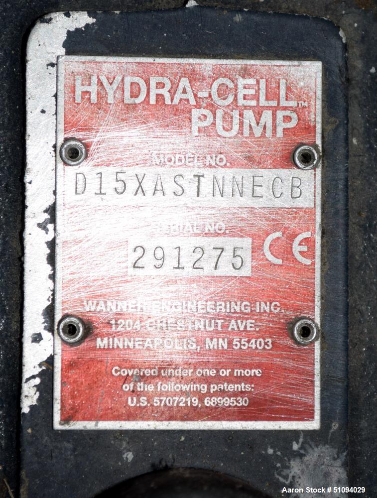 Used Hydra-Cell Diaphragm Pump, Model D15XASTNNECB, 316L Stainless Steel. Maximum flow 13.8 gallons per minute at 1450 rpm. 1-1/4" NPT Inlet, approximate 3/4" NPT outlet. Driven by a 10hp, 3/60/230/4...