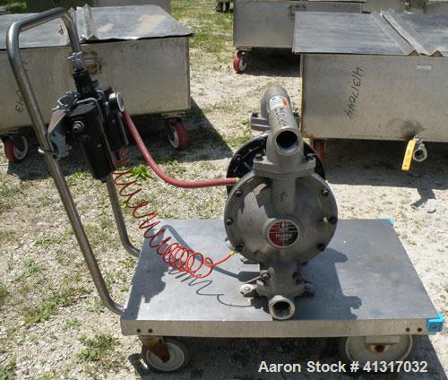 Used Husky Air Operated Double Diaphragm Pump, Series B99A, 316 Stainless Steel. 2" NPT inlet/outlet.  Rated maximum 100 gallons per minute, 120 psi.  Mounted on a carbon steel cart with casters.