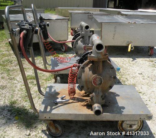 Used Husky Air Operated Double Diaphragm Pump, Series B99A, 316 Stainless Steel. 2" NPT inlet/outlet.  Rated maximum 100 gallons per minute, 120 psi.  Mounted on a carbon steel cart with casters.