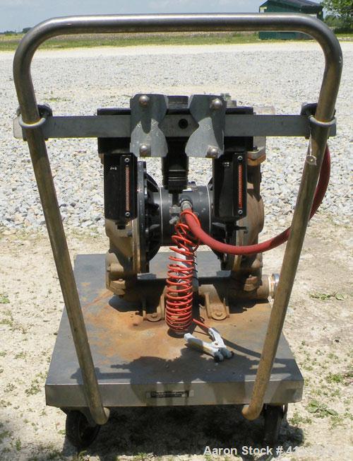 Used Husky Air Operated Double Diaphragm Pump, Series B99A, 316 Stainless Steel. 2" NPT inlet/outlet.  Rated maximum 100 gallons per minute, 120 psi.  Mounted on a carbon steel cart with casters.