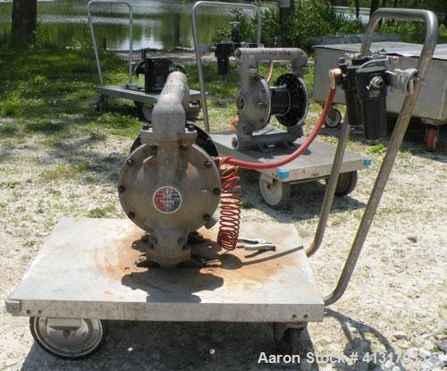 Used Husky Air Operated Double Diaphragm Pump, Series B99A, 316 Stainless Steel. 2" NPT inlet/outlet.  Rated maximum 100 gallons per minute, 120 psi.  Mounted on a carbon steel cart with casters.