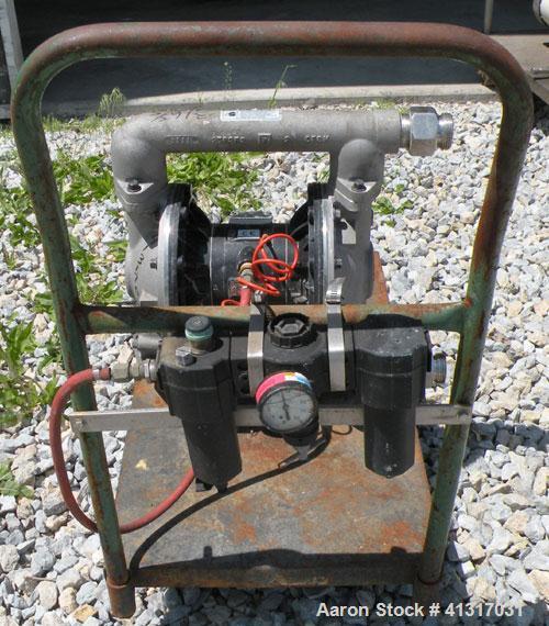 Used Husky Air Operated Double Diaphragm Pump, Series E98A, 316 Stainless Steel. 2" NPT inlet/outlet.  Rated maximum 100 gallons per minute, 120 psi.  Mounted on a carbon steel cart with casters.