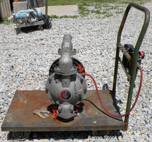 Used Husky Air Operated Double Diaphragm Pump, Series E98A, 316 Stainless Steel. 2" NPT inlet/outlet.  Rated maximum 100 gallons per minute, 120 psi.  Mounted on a carbon steel cart with casters.