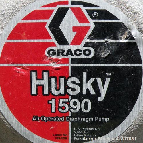 Used Husky Air Operated Double Diaphragm Pump, Series E98A, 316 Stainless Steel. 2" NPT inlet/outlet.  Rated maximum 100 gallons per minute, 120 psi.  Mounted on a carbon steel cart with casters.