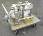 Used Wilden Air Operated Double Diaphragm Pump, Model A8T/SAAA/FG/FG/FG/129, 316 Stainless Steel. Rated approximate 111 gallons per minute, 1/4