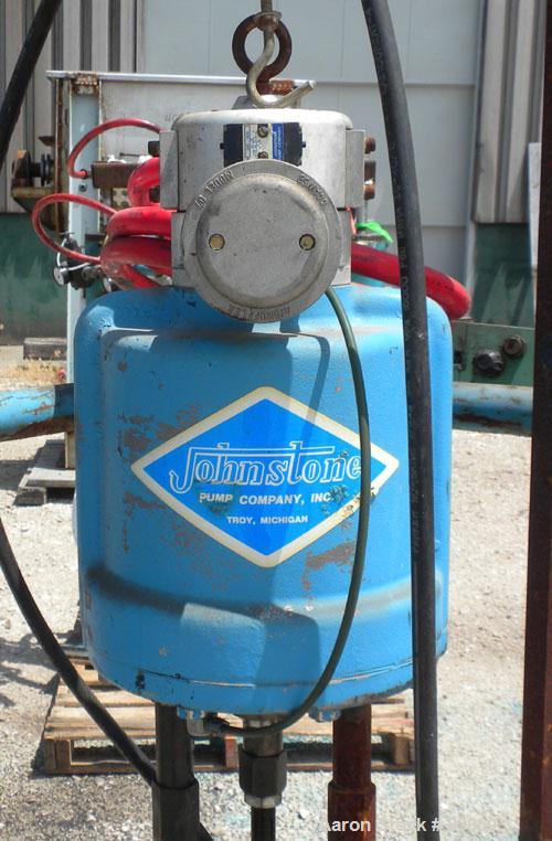 Used Johnstone Air Operated 55 Gallon Drum Unloading Pump, Model 98KLXGC3AX. 8" Air motor, ratio 42:1, 20 psi to 100 psi operating range, 12 cubic inch volume per cycle. Base mounted.