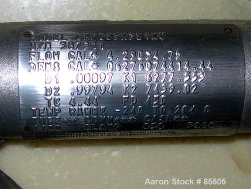 USED: Micro Motion flow meter, model CMF025M321MU, 316 stainless steel product contact areas. Flow cal 4.29034-75, dens flow 06276074414.44. Rated volume 10 gallons per minute, mass 80 pounds per min...