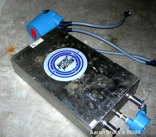 Used Micro Motion Flow Meter, Model DL100S202SU, 316 Stainless Steel Product Contact Areas. Flow cal 53.4594.26, dens flow 08904118854.26. Rated volume 0 to 60 gallons per minute, mass 0 to 500 pound...